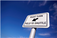 Right Turn Yield to Shuttle Sign