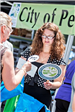 Woman Receiving Items at the Peachtree Corners Booth