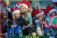 Children in Santa Hats Holding Candy Canes