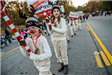 Children Marching in Parade Holding Signs