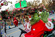 The Grinch Riding in a Parade Vehicle