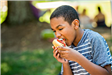 Child Eating a Sandwich