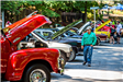 Man Walking and Looking at Classic Cars
