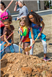 3 Children Shoveling Dirt