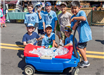Cub Scouts with Wagon of Water Bottles