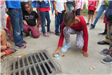 Child Labeling a Storm Drain