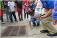 Child Labeling a Storm Drain