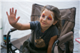 Child Seated for Face Painting