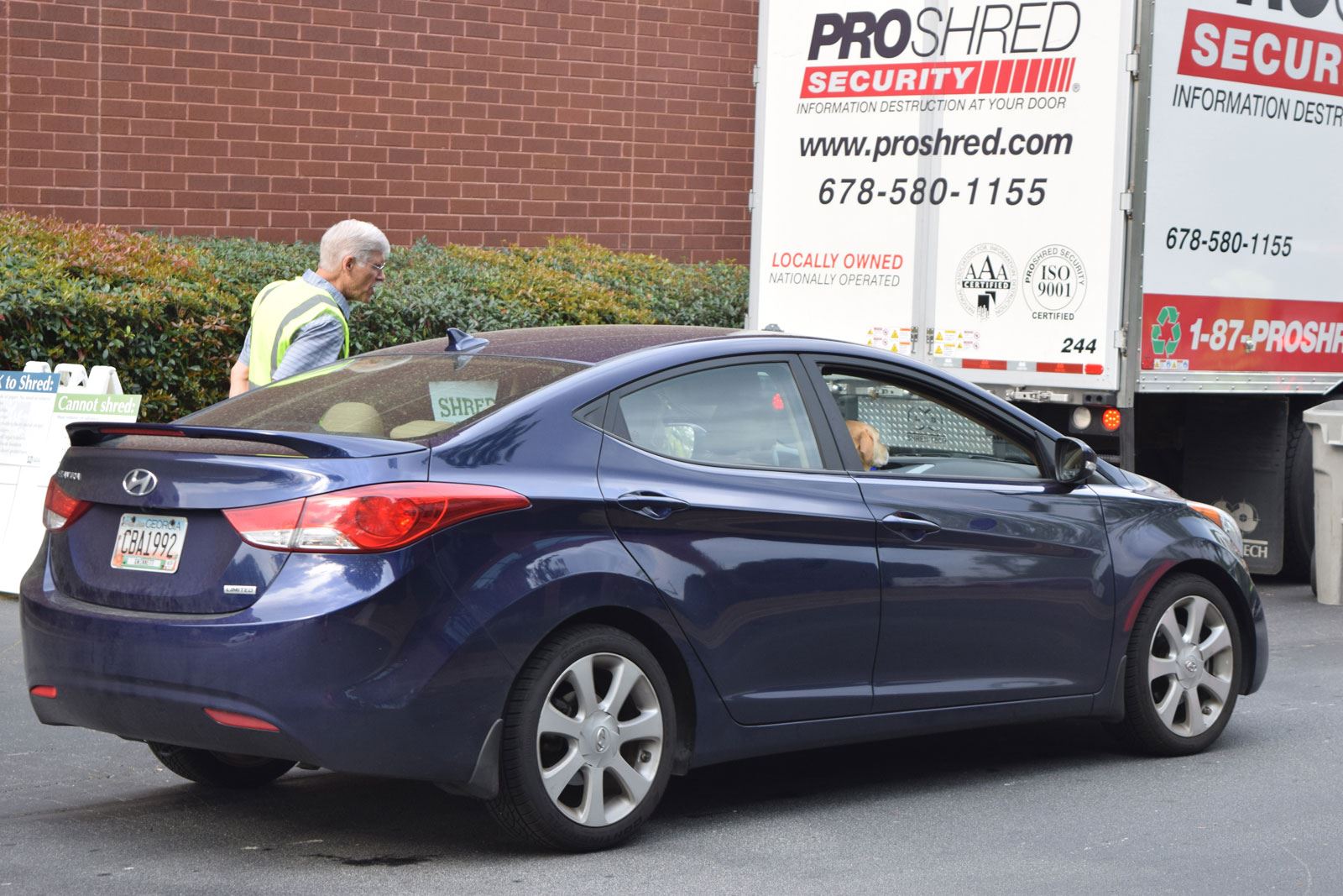 Volunteer Helps with Shredding