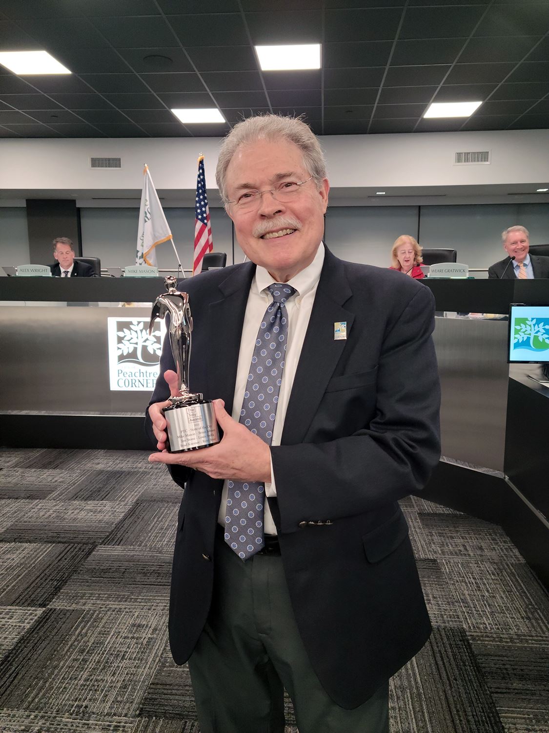 Mayor Mike Mason holding a Telly Award