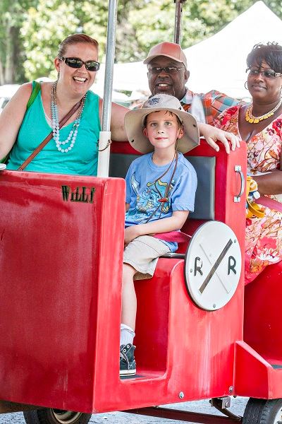 Adults and Children Riding Festival Train