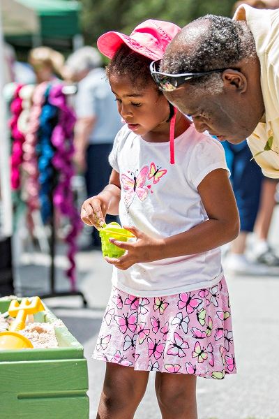 Man and Child Playing with Sand