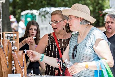 Women Looking at Jewelry Display