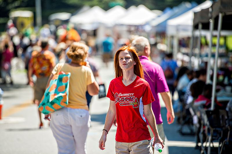 Adolescent Wearing Gwinnett Braves T-Shirt