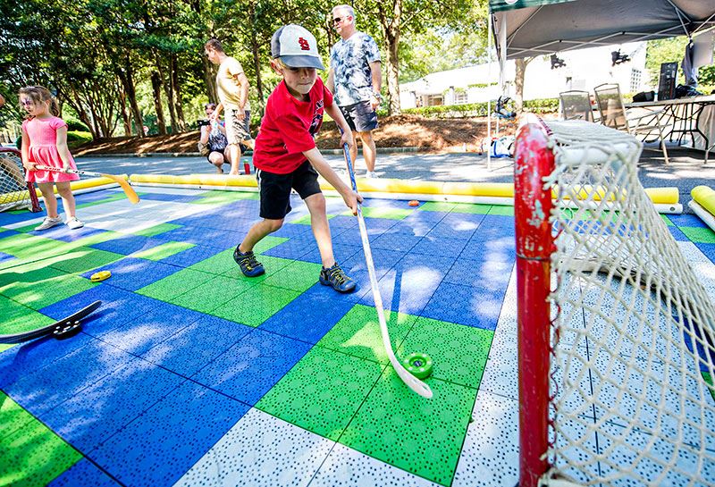 Children Playing Stick Hockey