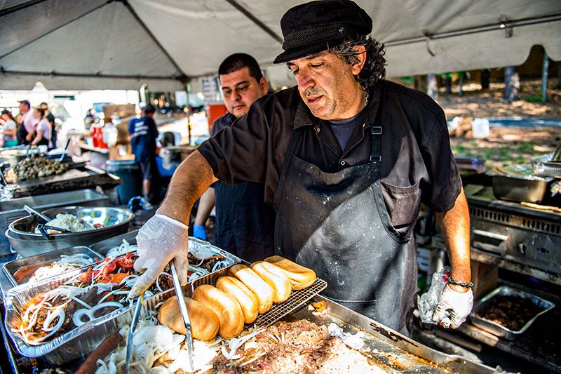 Cooking on a Grill at Food Booth