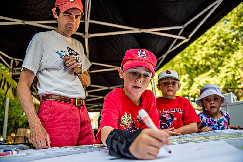 Man and Child Drawing with Marker