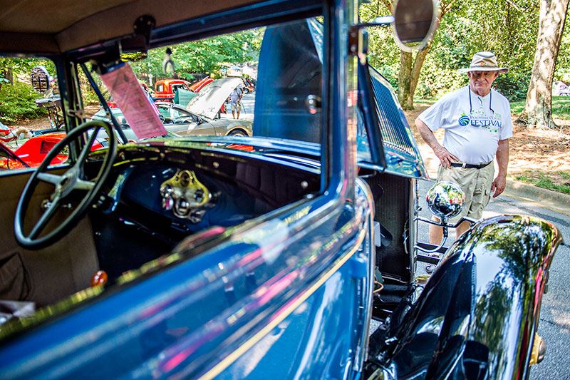 Man Looking at a Classic Car