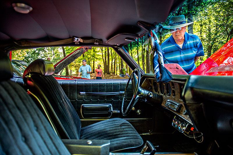 Man Looking Inside Classic Car