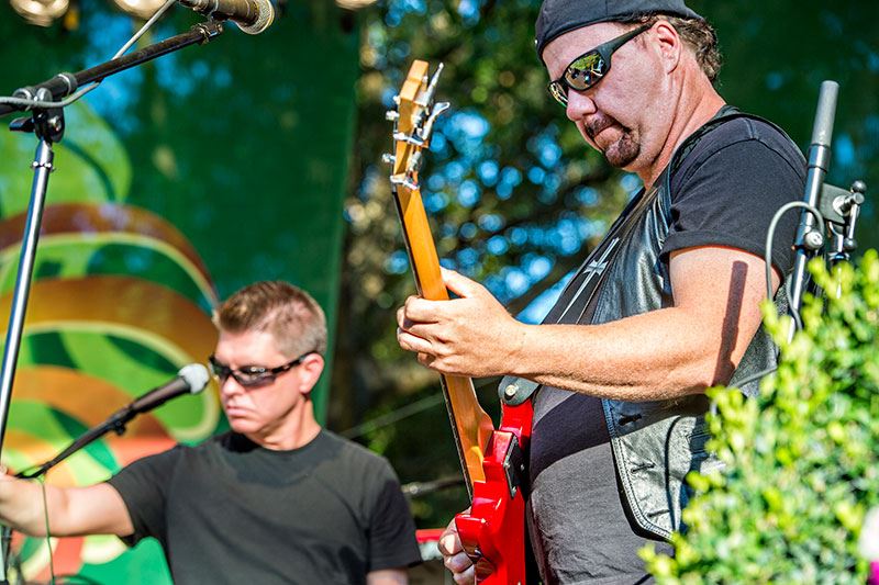 Man Playing Bass Guitar on Stage