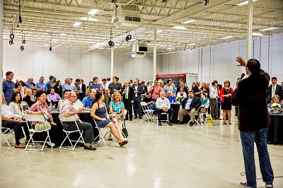 Executive Consultant Speaking to Crowd