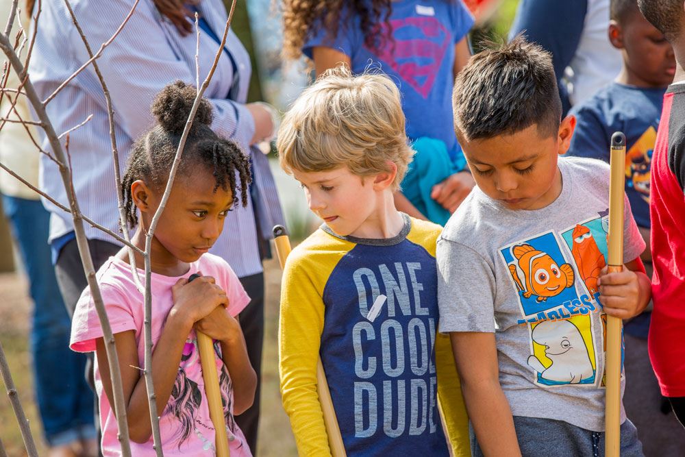 3 Children Holding Shovels