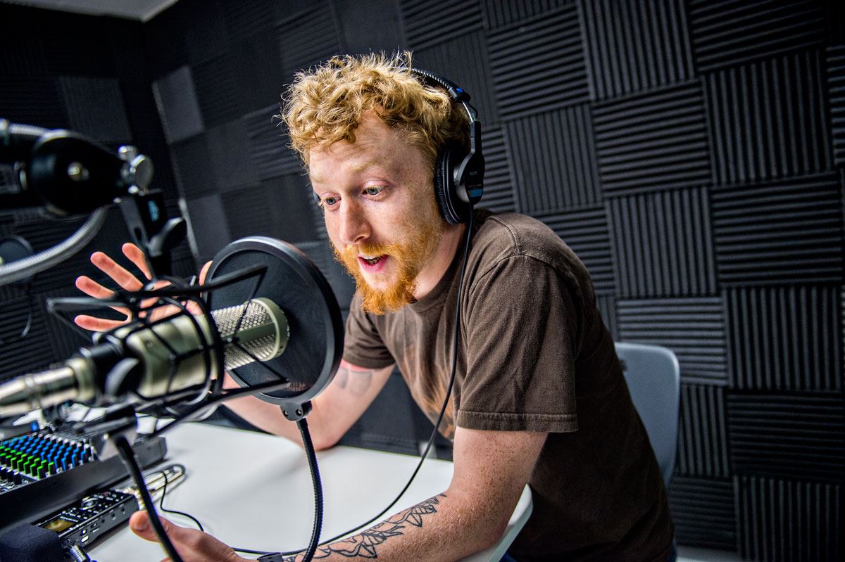 Person in Podcast Room