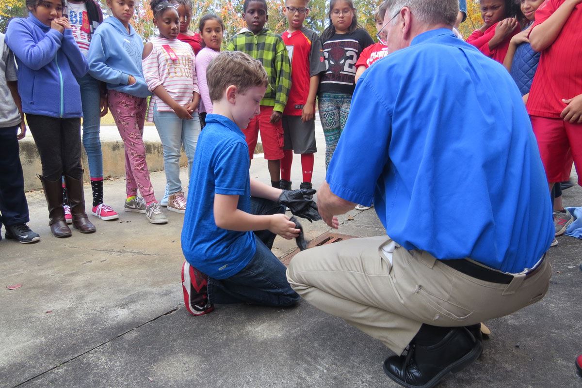 Child Putting on Gloves