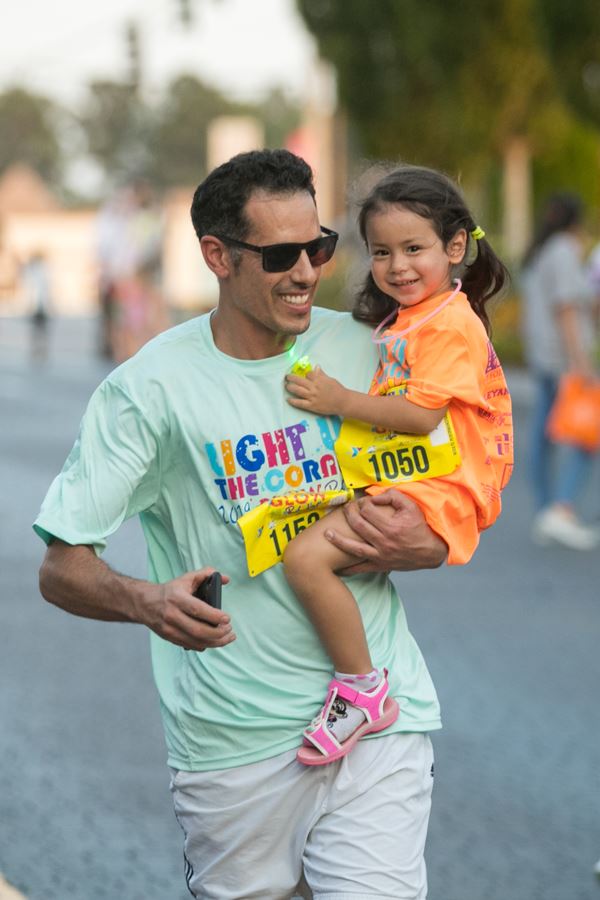 Man Carrying Daughter