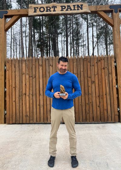 Craig Marker holding a trophy
